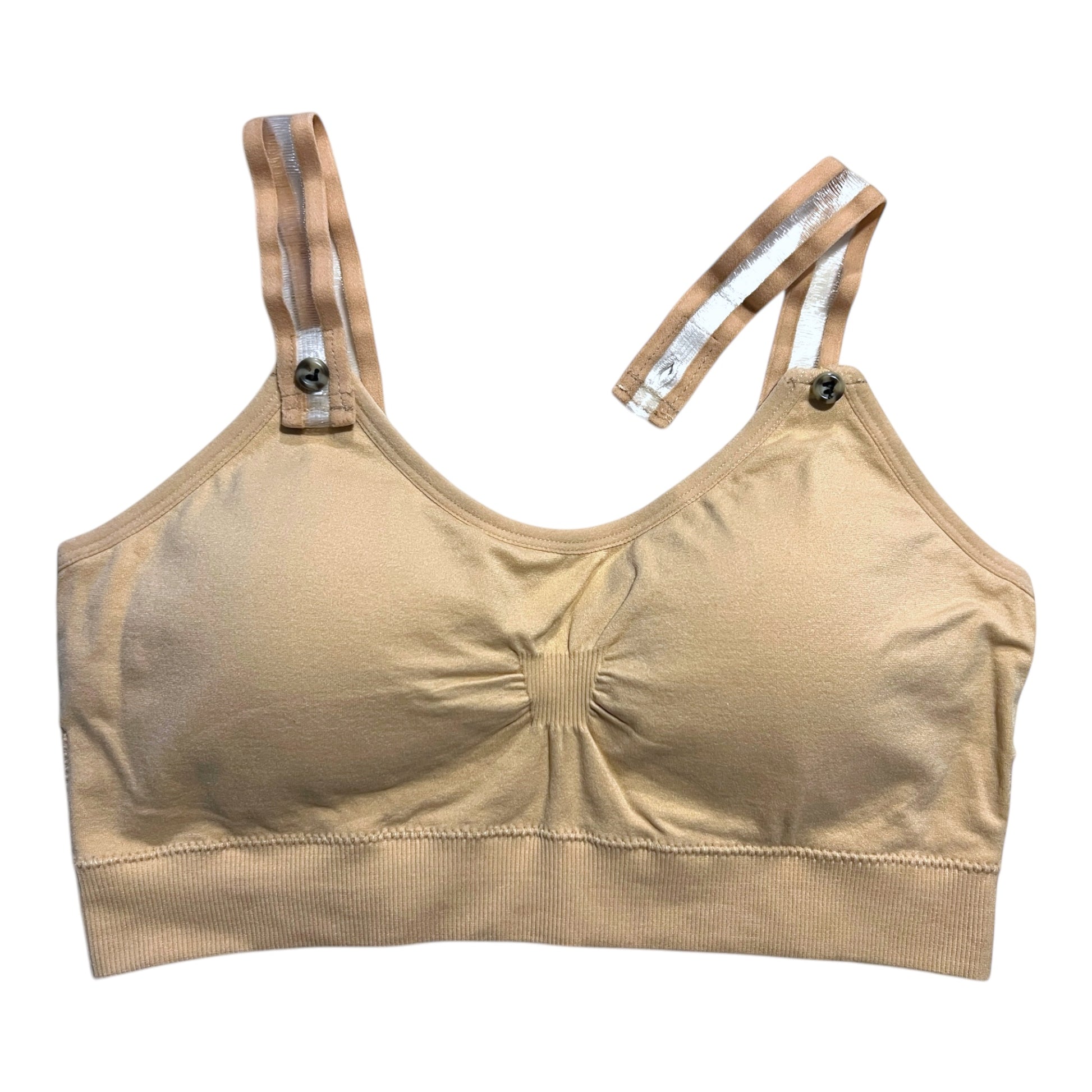 The photo displays a flat lay of a tan bra which closely resembles a sports bra. The straps are clear with a tan outline. To promote easy access the straps are equipped with buttons on the front to slide the straps into.