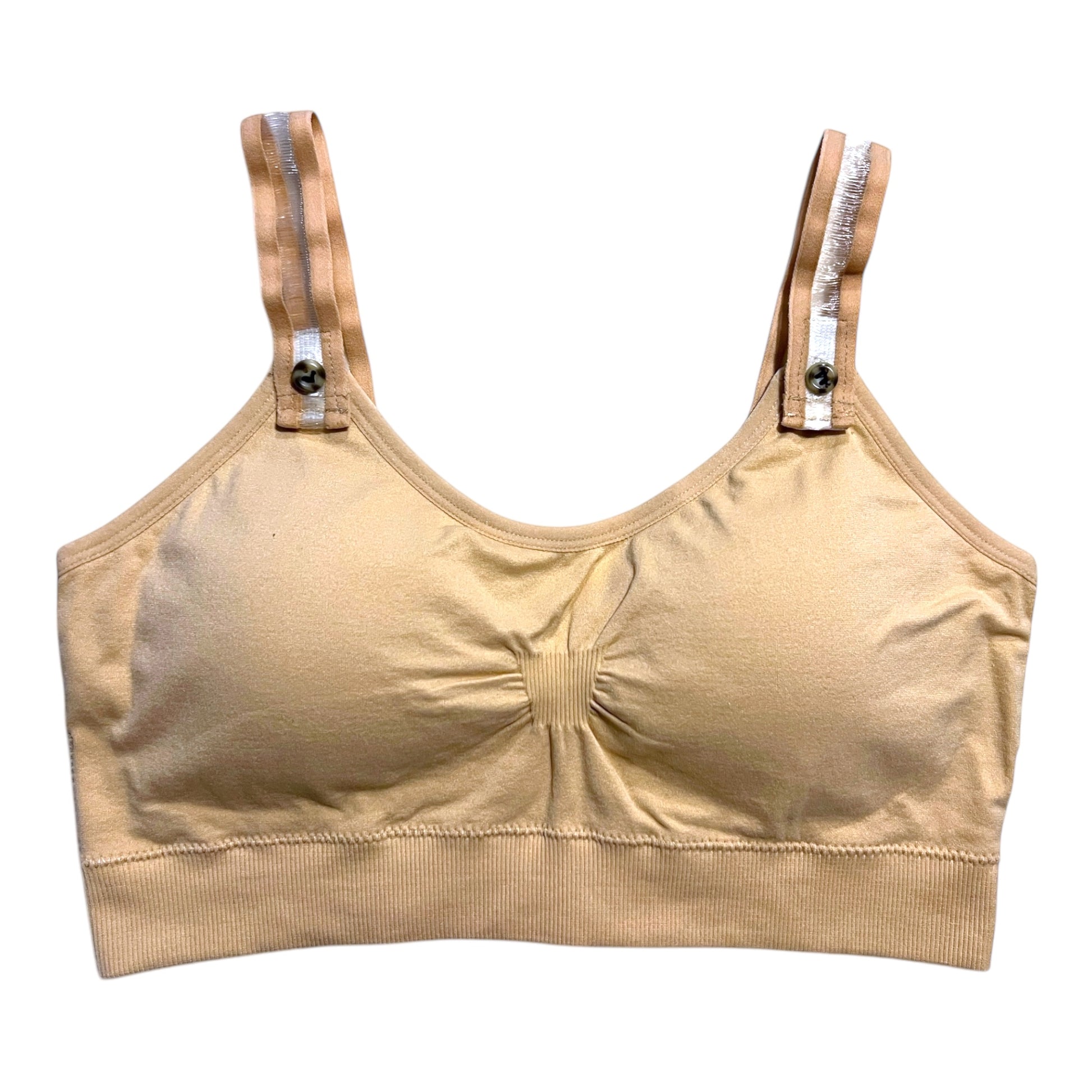 The photo displays a flat lay of a tan bra which closely resembles a sports bra. The straps are clear with a tan outline. To promote easy access the straps are equipped with buttons on the front to slide the straps into.